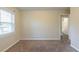 Bedroom with a window and neutral walls, carpeted floor and view into attached bathroom at 158 Polar Rock Sw Dr, Atlanta, GA 30315