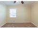 Bedroom showcasing carpeted floors, window, neutral wall color, and ceiling fan at 158 Polar Rock Sw Dr, Atlanta, GA 30315