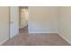 Bedroom features light beige carpet, a window with blinds, neutral walls and a hallway entrance at 158 Polar Rock Sw Dr, Atlanta, GA 30315