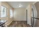 Eat-in kitchen with stainless steel refrigerator, white cabinets and view to the backyard at 158 Polar Rock Sw Dr, Atlanta, GA 30315