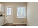 Bright kitchen area with a white door leading outside and a window with natural light at 158 Polar Rock Sw Dr, Atlanta, GA 30315