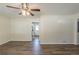 Open-concept living room with hardwood floors, natural light and a view into the kitchen at 158 Polar Rock Sw Dr, Atlanta, GA 30315