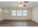 Spacious living room with modern ceiling fan, hardwood floors and natural light streaming in at 158 Polar Rock Sw Dr, Atlanta, GA 30315