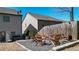 Backyard fire pit area featuring Adirondack chairs, wood storage, and an outdoor heater near the house at 209 Providence Walk Ct, Canton, GA 30114