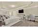 Spacious main bedroom featuring tray ceilings, desk, ample light, and neutral colors at 209 Providence Walk Ct, Canton, GA 30114