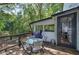 Outdoor dining on a back deck overlooking private backyard, perfect for entertaining and relaxation at 1240 Evans Cook Rd, Canton, GA 30115