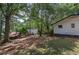 Large backyard with mature trees, offering plenty of shade and privacy at 1240 Evans Cook Rd, Canton, GA 30115