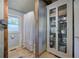 Elegant bathroom featuring decorative storage cabinet, white tiled walls, and rustic accents at 1240 Evans Cook Rd, Canton, GA 30115