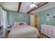 Bedroom with a ceiling fan, exposed wood beams, wood floors, and neutral decor at 1240 Evans Cook Rd, Canton, GA 30115