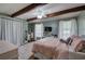 Bedroom with a ceiling fan, exposed wood beams and two windows for natural light at 1240 Evans Cook Rd, Canton, GA 30115