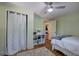 Bedroom with a ceiling fan, wood floors, and neutral decor at 1240 Evans Cook Rd, Canton, GA 30115