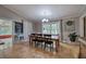 Dining room with wood floors, a modern light fixture, and a large picture window at 1240 Evans Cook Rd, Canton, GA 30115