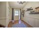 Inviting entryway featuring a wood door, hardwood floors, decorative accents, and a neutral color palette at 1240 Evans Cook Rd, Canton, GA 30115