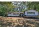 Charming home with white siding, black shutters and inviting front porch at 1240 Evans Cook Rd, Canton, GA 30115