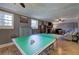 Large game room with a ping pong table and a cozy sitting area at 1240 Evans Cook Rd, Canton, GA 30115