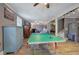 Spacious game room with a ping pong table, built-in shelving, a gray color scheme, and ample room for recreation at 1240 Evans Cook Rd, Canton, GA 30115