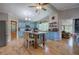 Bright, open kitchen with blue cabinets, an island, modern appliances, and an abundance of natural light at 1240 Evans Cook Rd, Canton, GA 30115