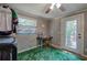 Laundry room with a view to the backyard, a ceiling fan, and a desk at 1240 Evans Cook Rd, Canton, GA 30115