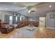 Relaxing living room with hardwood floors, comfortable furniture, and three large windows at 1240 Evans Cook Rd, Canton, GA 30115