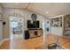 Bright living area with hardwood floors, seamless transitions to kitchen, and views of the stone fireplace, creating a cohesive space at 1240 Evans Cook Rd, Canton, GA 30115