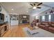 Cozy living room with stone fireplace, hardwood floors, and comfortable seating arrangement at 1240 Evans Cook Rd, Canton, GA 30115