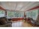 Sunroom with wood floors and lots of windows at 1240 Evans Cook Rd, Canton, GA 30115