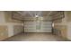 Spacious unfinished garage with a large overhead door and ample storage potential at 1393 Vayda Ct, Marietta, GA 30066