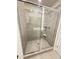 Modern tiled shower features glass doors and a shower head at 1393 Vayda Ct, Marietta, GA 30066