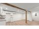 This finished basement features white cabinets, laminate flooring, and exposed wooden beams at 1937 Joseph Ct, Decatur, GA 30032