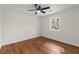 Bedroom features hardwood floors, a ceiling fan, a window, and neutral paint at 1937 Joseph Ct, Decatur, GA 30032