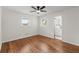 Bright bedroom featuring hardwood floors, ceiling fan and ensuite bathroom at 1937 Joseph Ct, Decatur, GA 30032