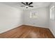 Bedroom features hardwood floors, a ceiling fan, a window, and neutral paint at 1937 Joseph Ct, Decatur, GA 30032