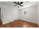 Bedroom features hardwood floors, a ceiling fan, a window, and neutral paint at 1937 Joseph Ct, Decatur, GA 30032