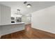 Modern kitchen featuring white cabinets, stainless steel appliances, and a sleek breakfast bar, perfect for entertaining at 1937 Joseph Ct, Decatur, GA 30032