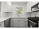 Bright kitchen features white cabinetry, marble countertops, stainless steel appliances, and a window view at 1937 Joseph Ct, Decatur, GA 30032