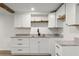 Basement kitchenette featuring white cabinets and granite countertops at 1937 Joseph Ct, Decatur, GA 30032