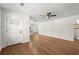 Bright living area with hardwood floors flowing towards the entry door and a glimpse of the modern kitchen in the background at 1937 Joseph Ct, Decatur, GA 30032