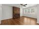 Stylish living room featuring modern fireplace, hardwood floors, and natural light from large windows creating a warm ambiance at 1937 Joseph Ct, Decatur, GA 30032