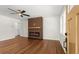 Modern living room with hardwood floors, statement fireplace, ceiling fan, and natural light at 1937 Joseph Ct, Decatur, GA 30032