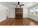 Living room features hardwood floors, a modern ceiling fan, a statement fireplace and plenty of natural light at 1937 Joseph Ct, Decatur, GA 30032