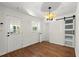 White room with luxury vinyl floors and a sliding barn door at 1937 Joseph Ct, Decatur, GA 30032