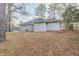 Expansive backyard featuring a mix of grass and natural ground cover at 2303 Pinewood Dr, Decatur, GA 30032