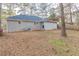 Large backyard with a mix of grass and natural ground cover and partial fencing at 2303 Pinewood Dr, Decatur, GA 30032