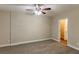 Spacious bedroom with neutral walls and carpet and ceiling fan at 2303 Pinewood Dr, Decatur, GA 30032