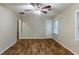 Large bedroom with natural light, a ceiling fan, and stylish hardwood floors at 2303 Pinewood Dr, Decatur, GA 30032