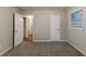 Bedroom featuring plush carpet, fresh paint, and doorway leading to other rooms at 2303 Pinewood Dr, Decatur, GA 30032