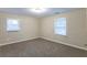 Neutral bedroom with carpet and two windows at 2303 Pinewood Dr, Decatur, GA 30032