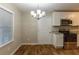 Dining area featuring white cabinets, stainless steel appliances and hardwood flooring at 2303 Pinewood Dr, Decatur, GA 30032