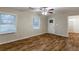 Bright living room features wood-look flooring, neutral paint, and ceiling fan at 2303 Pinewood Dr, Decatur, GA 30032