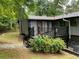 Exterior view of home with spacious deck and well-maintained landscaping at 3630 High Point Sw Ln, Atlanta, GA 30331